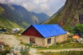 Cottage in high mountains valley. ÃÂ¡loudy summer day